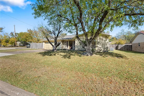 a view of house with outdoor space and garden