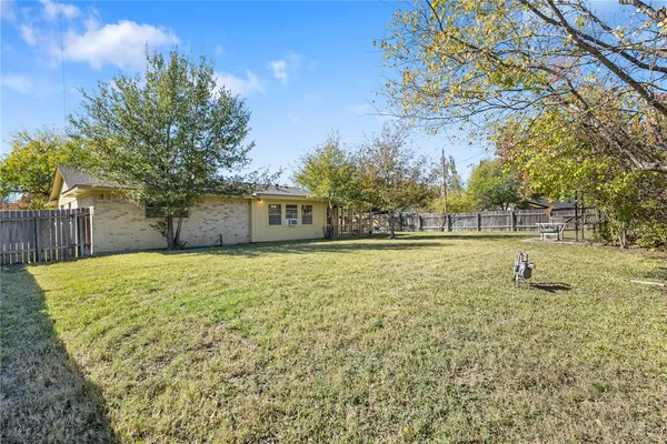 a view of backyard with green space