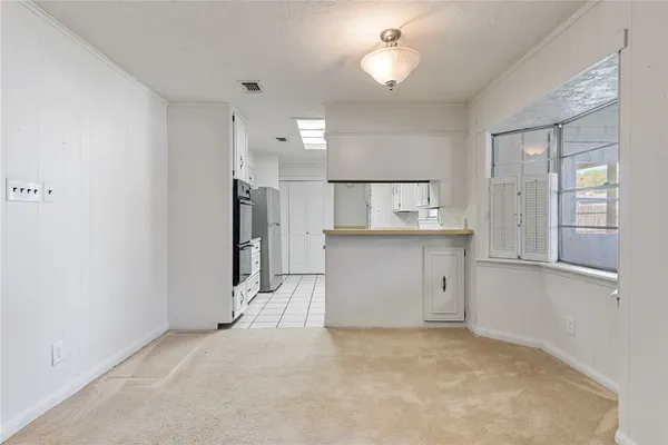 a kitchen with a sink appliances and cabinets