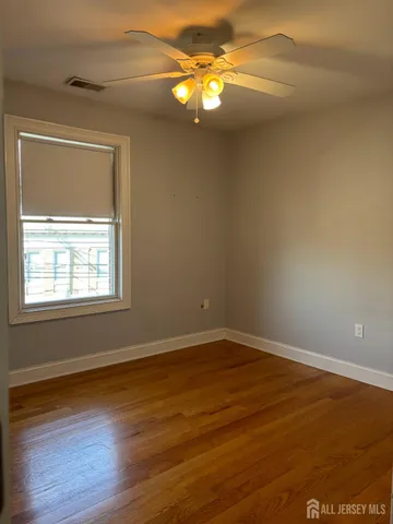 a view of staircase with wooden floor
