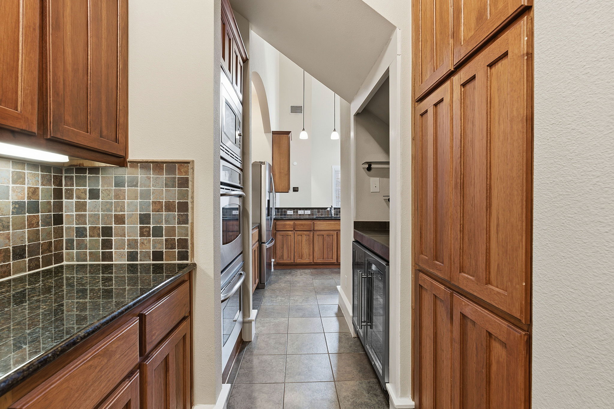 2506 Enfield Road, Unit B Austin, TX 78703 - Photo 12 of 40 a kitchen with a refrigerator a stove and cabinets