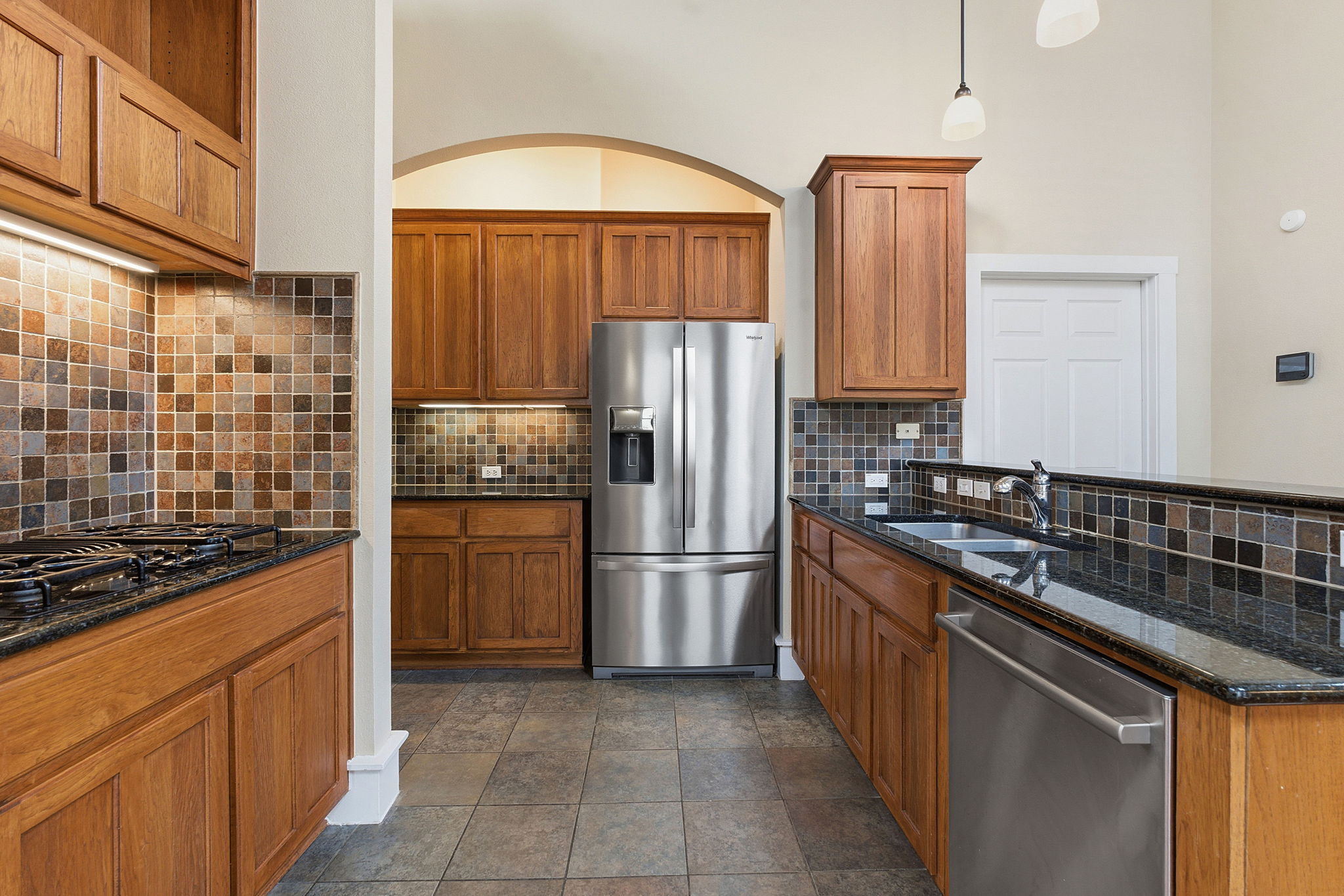 2506 Enfield Road, Unit B Austin, TX 78703 - Photo 15 of 40 a kitchen with a refrigerator sink and stove