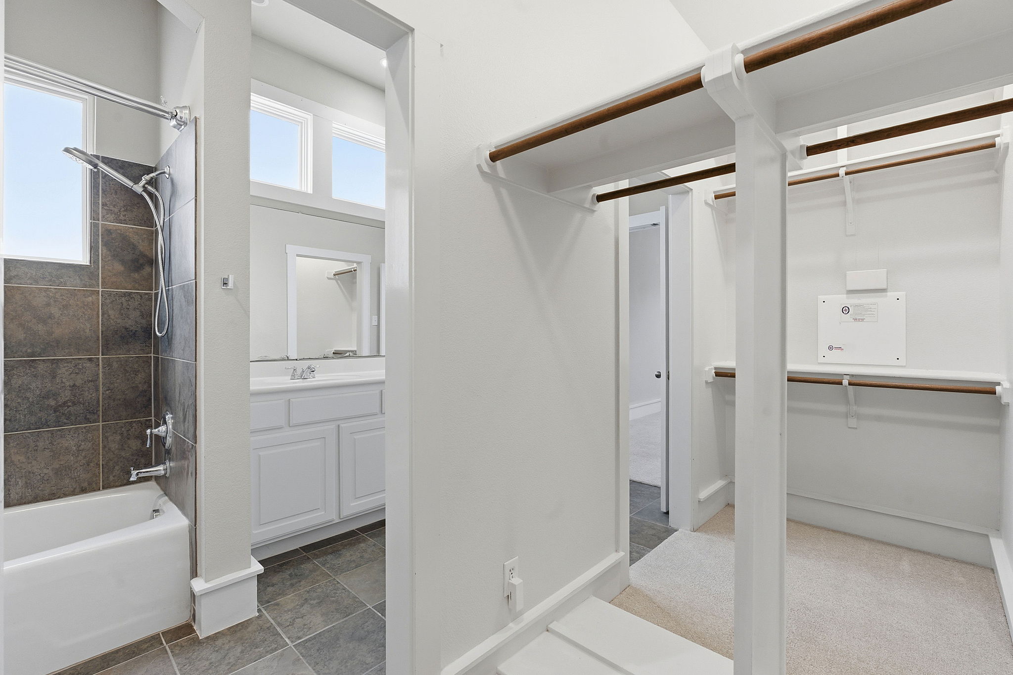 2506 Enfield Road, Unit B Austin, TX 78703 - Photo 25 of 40 a bathroom with a tub shower and sink
