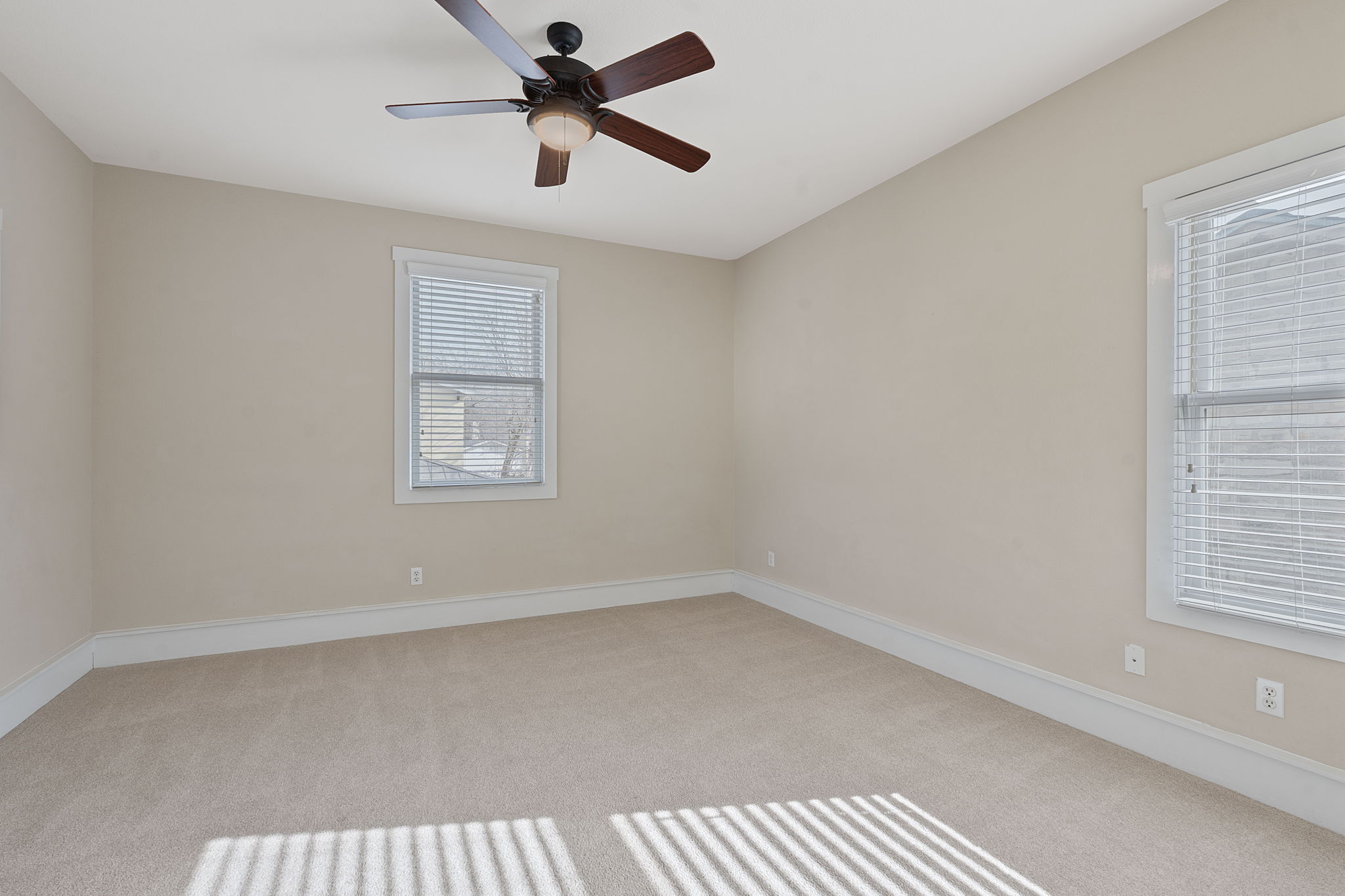 2506 Enfield Road, Unit B Austin, TX 78703 - Photo 28 of 40 an empty room with a window and a fan