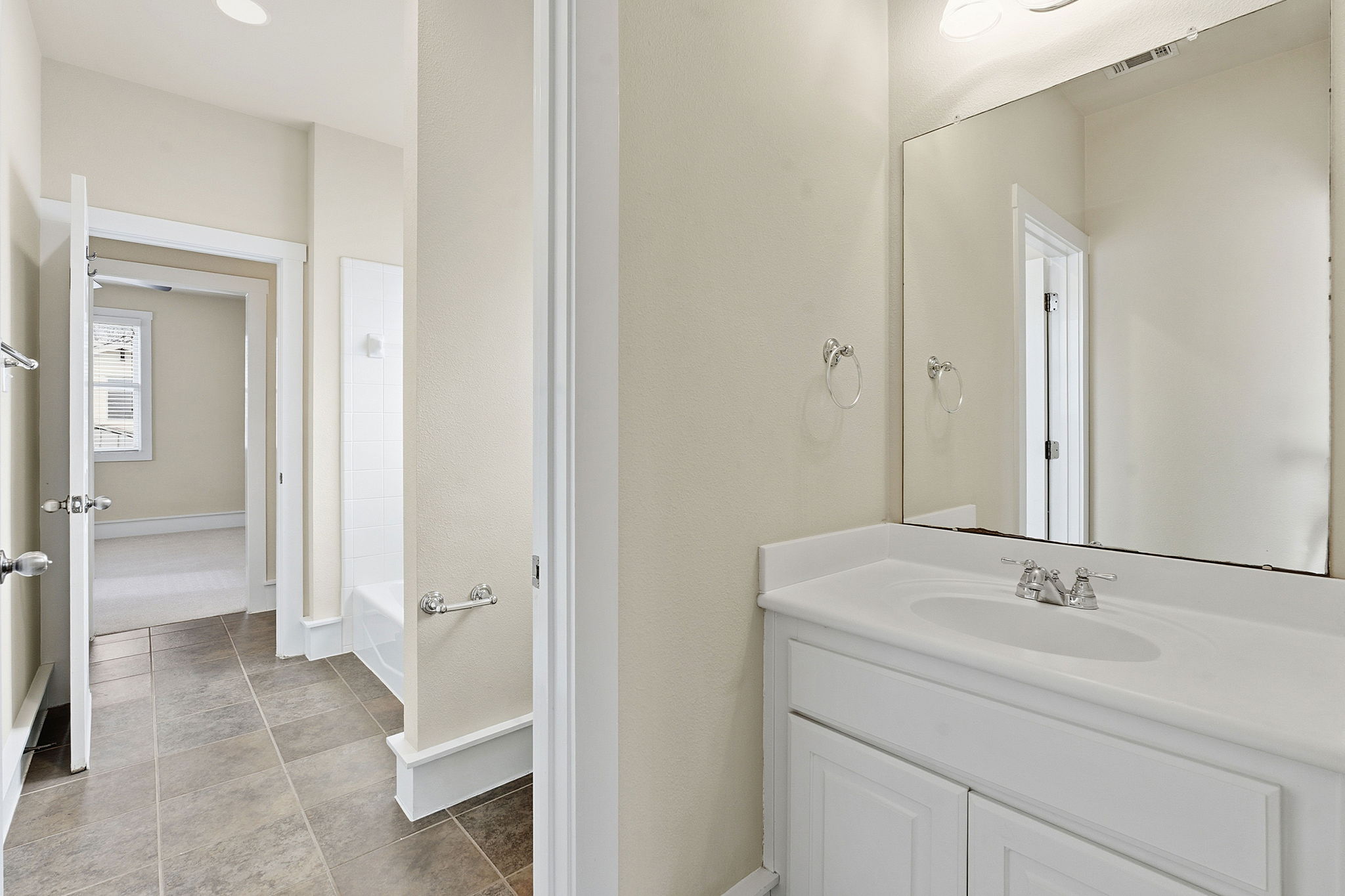 2506 Enfield Road, Unit B Austin, TX 78703 - Photo 32 of 40 a bathroom with a sink and a mirror