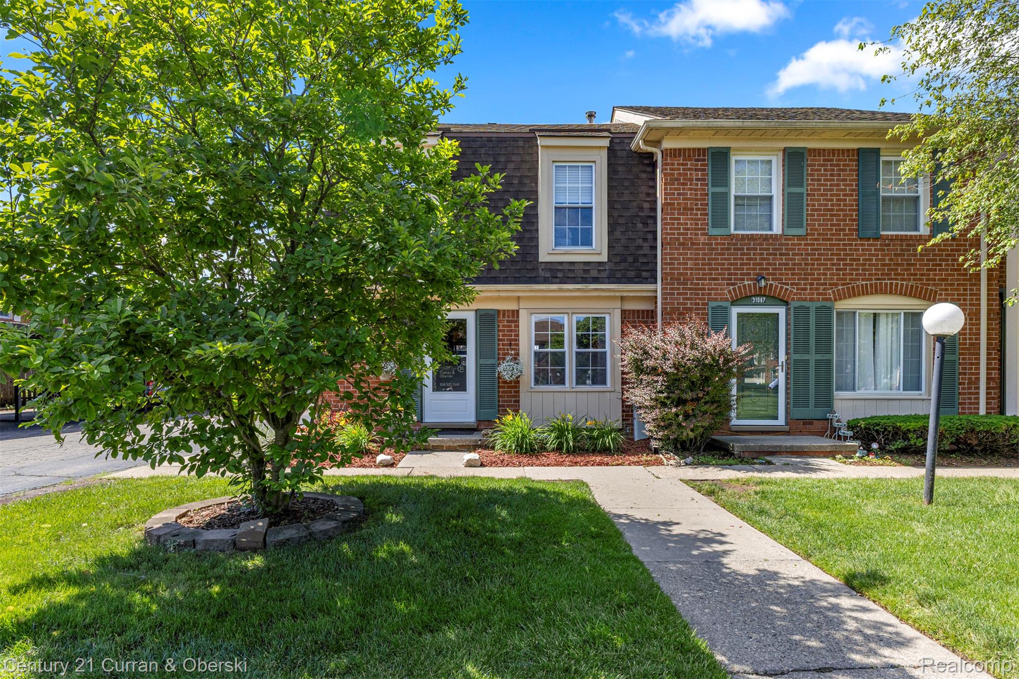 31083 Hoover Road, Unit 12 Warren, MI 48093 - Photo 1 of 39 Brick exterior with green shutters and white trim