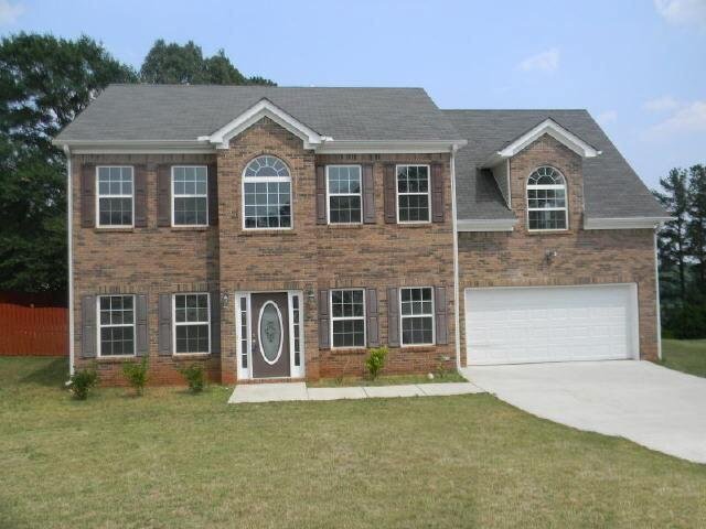 5850 Mays Ridge Court Rex, GA 30273 - Photo 1 of 1 a front view of a house with a garden
