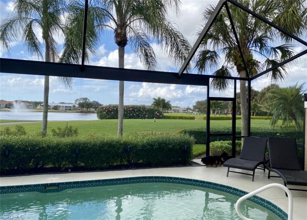 9035 Spring Run Boulevard Estero, FL 34135 - Photo 2 of 9 Outdoor pool with a water view and a lawn