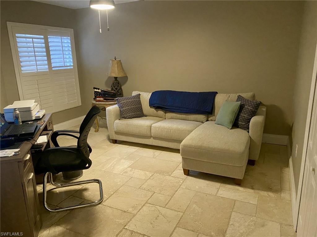 9035 Spring Run Boulevard Estero, FL 34135 - Photo 3 of 9 Office space featuring stone tile flooring and baseboards