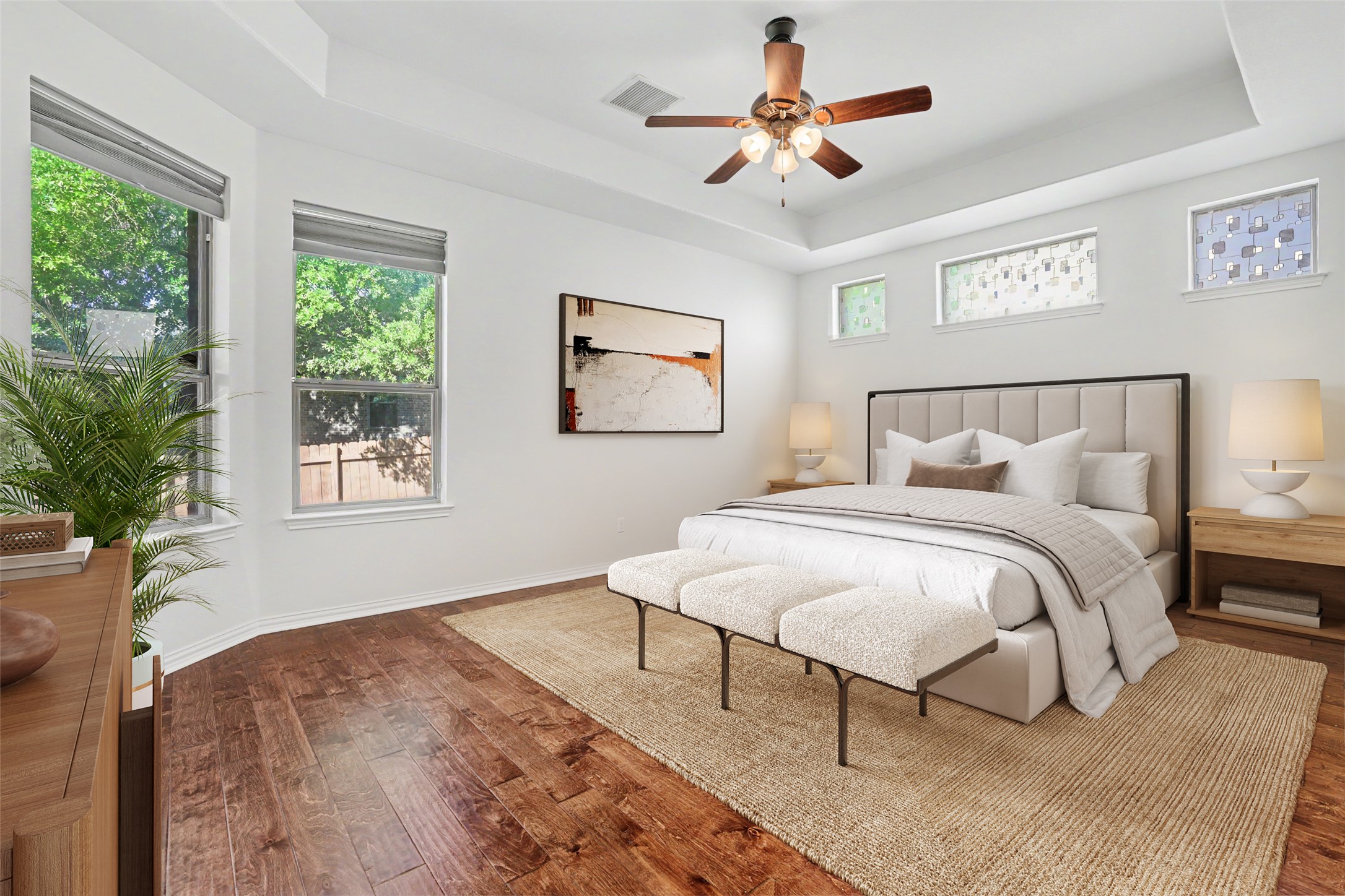 1020 Winding Way Drive Georgetown, TX 78628 - Photo 14 of 32 Bedroom featuring a raised ceiling, hardwood / wood-style flooring, multiple windows, and a ceiling fan
