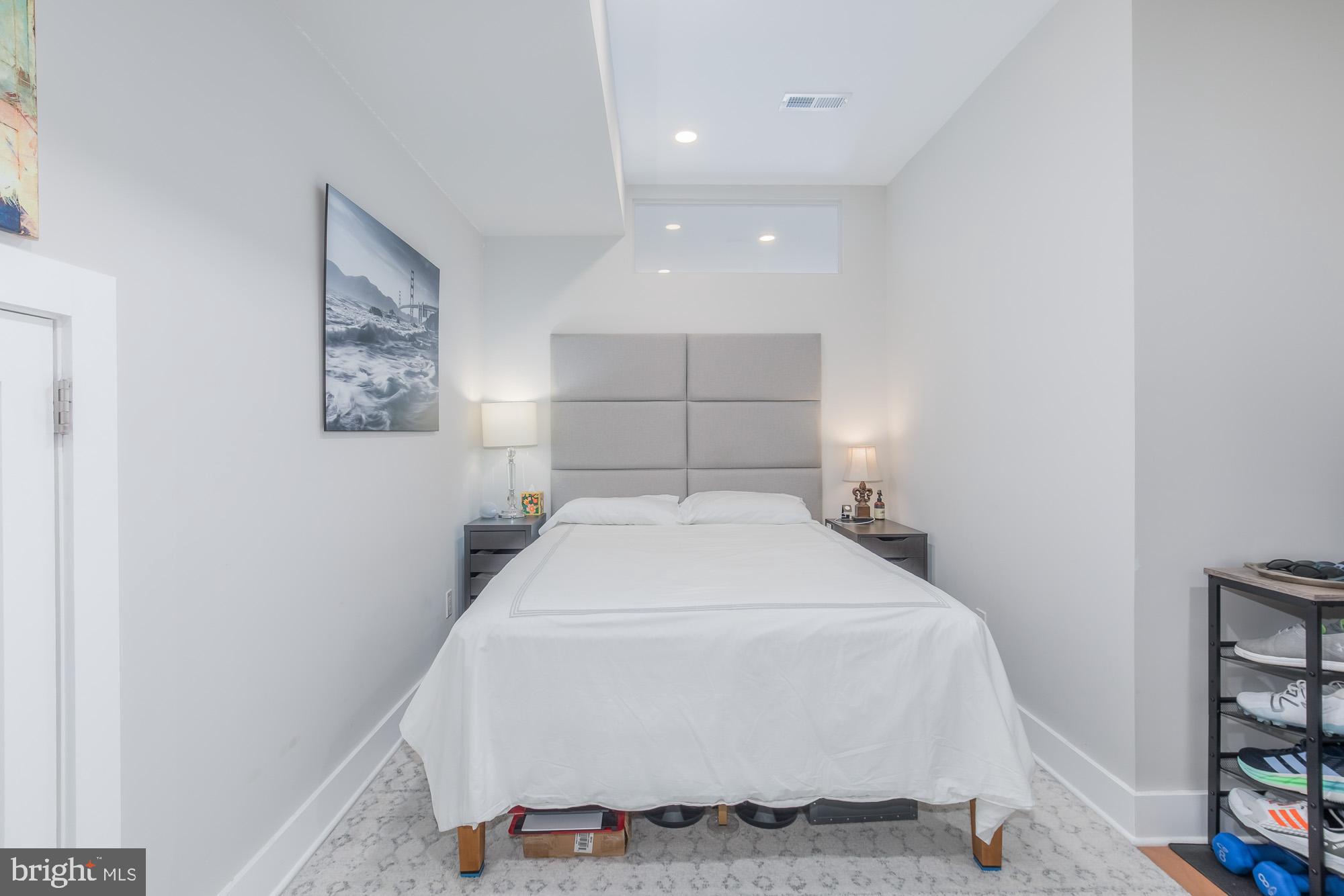 1444 Harvard Street Northwest, Unit 302 Washington, DC 20009 - Photo 23 of 50 a bedroom with a bed and a window
