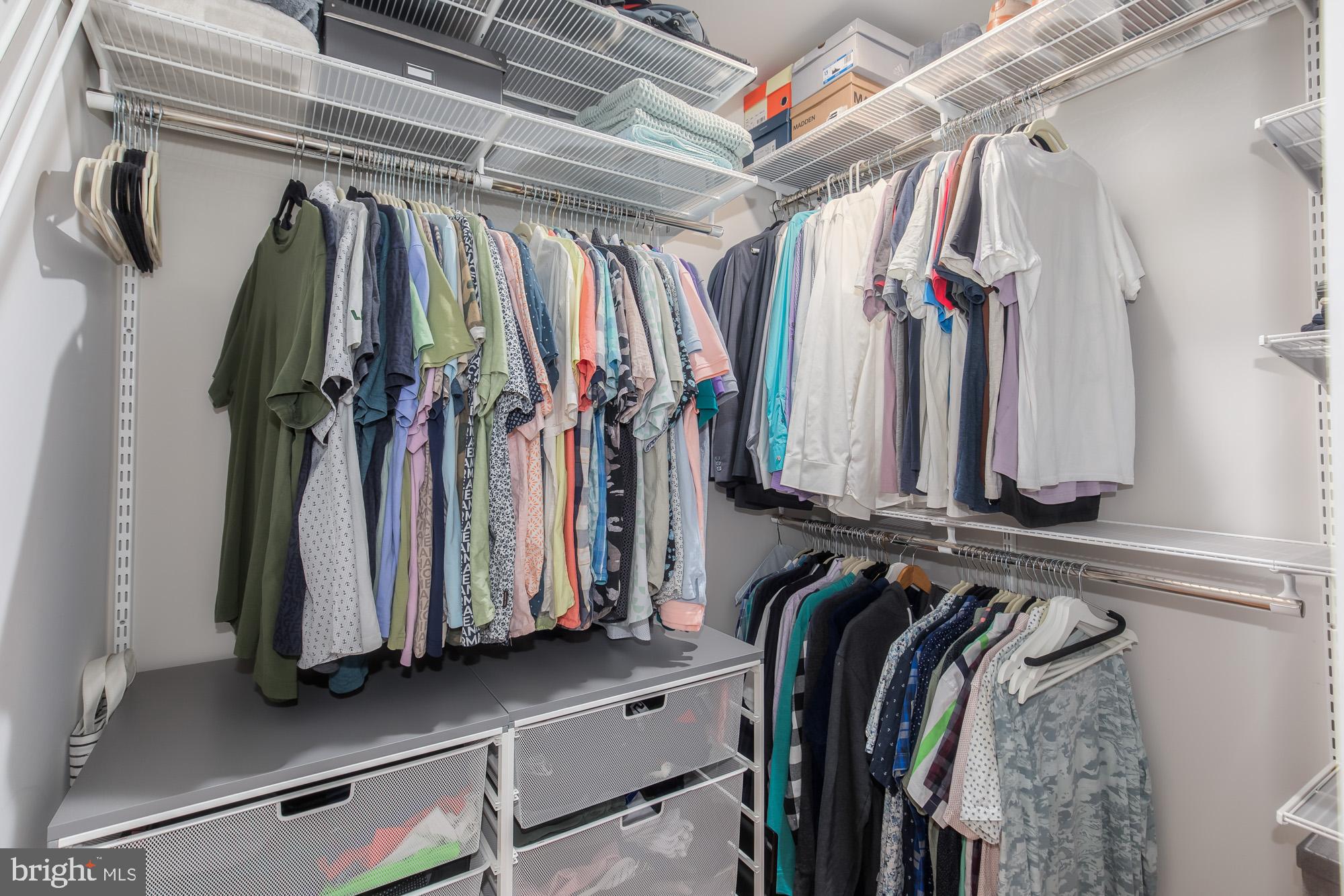1444 Harvard Street Northwest, Unit 302 Washington, DC 20009 - Photo 28 of 50 a view of walk in closet with clothes and shoes