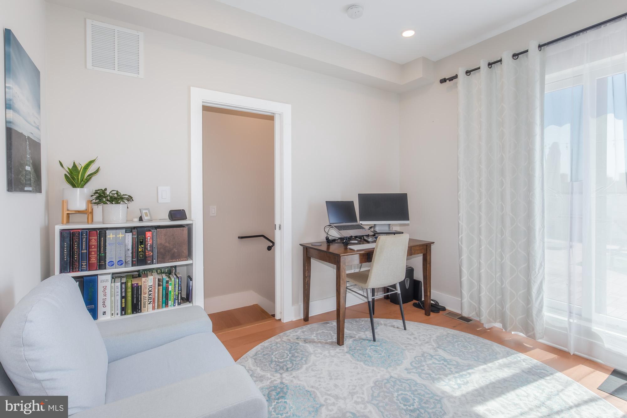 1444 Harvard Street Northwest, Unit 302 Washington, DC 20009 - Photo 33 of 50 a view of a livingroom with furniture and a window