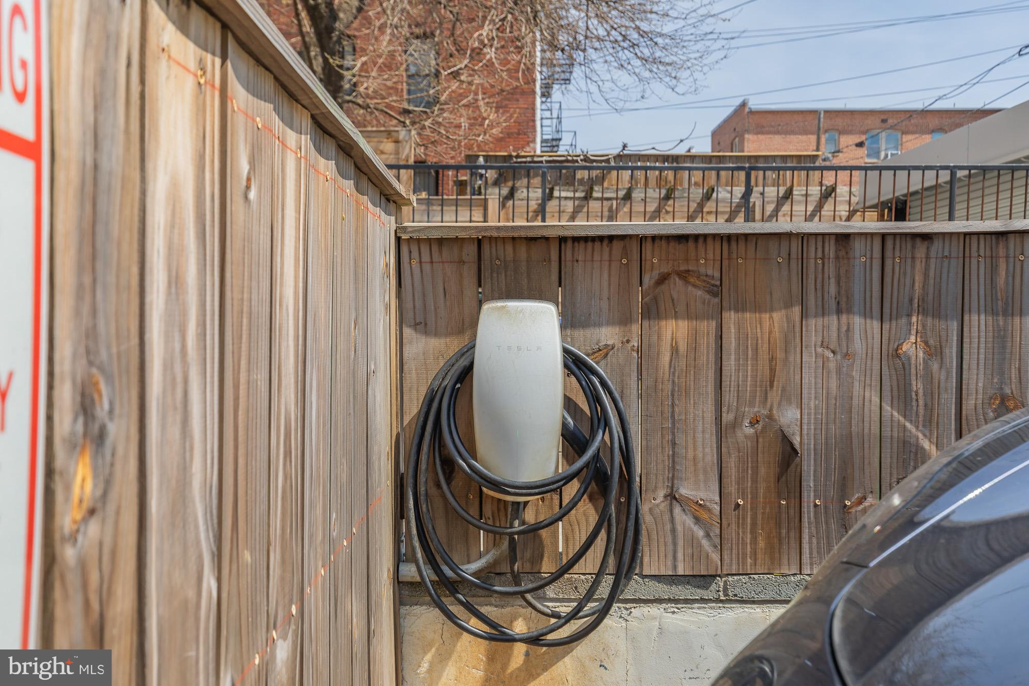 1444 Harvard Street Northwest, Unit 302 Washington, DC 20009 - Photo 50 of 50 a table with chair and a wooden fence