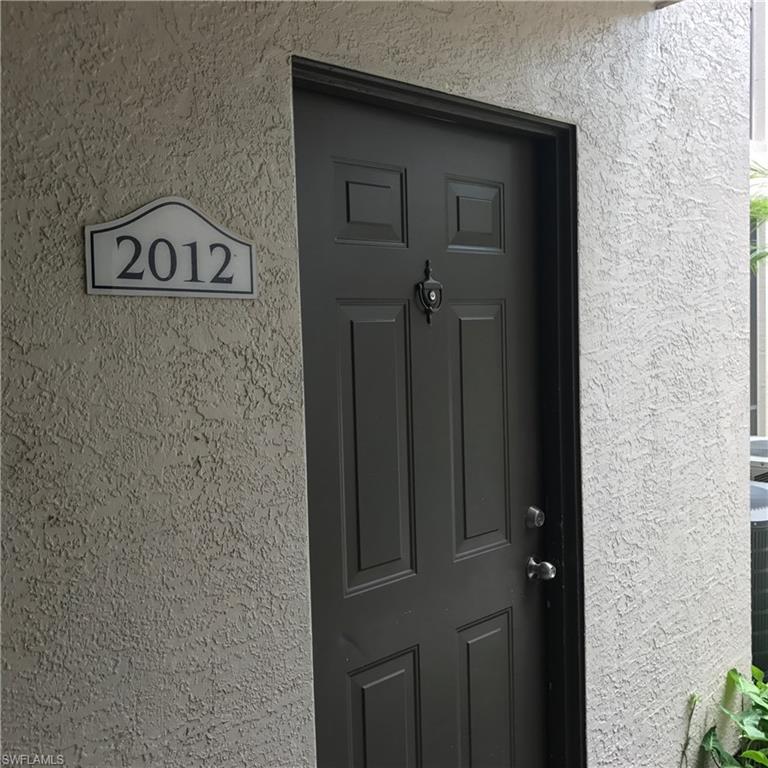 2214 Arbour Walk Circle, Unit 2012 Naples, FL 34109 - Photo 9 of 17 a close view of a door and an entryway