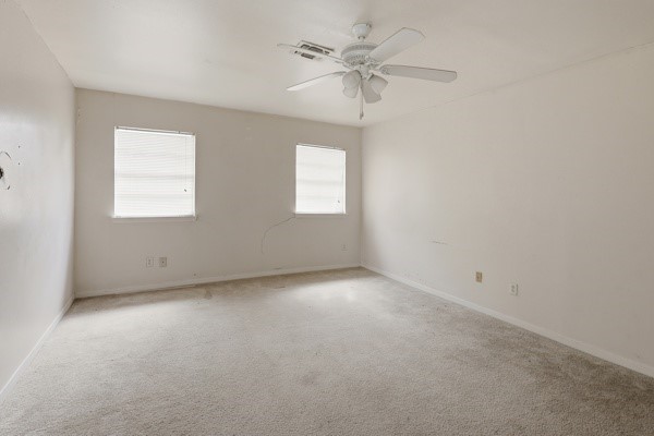 1655 Hawthorne Street Houston, TX 77006 - Photo 18 of 39 an empty room with a window and a fan