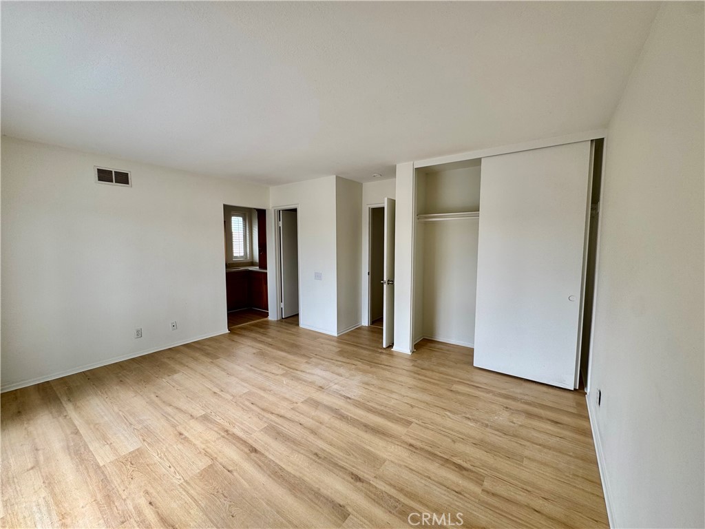 3 Atlanta Irvine, CA 92620 - Photo 12 of 14 an empty room with closet and wooden floor