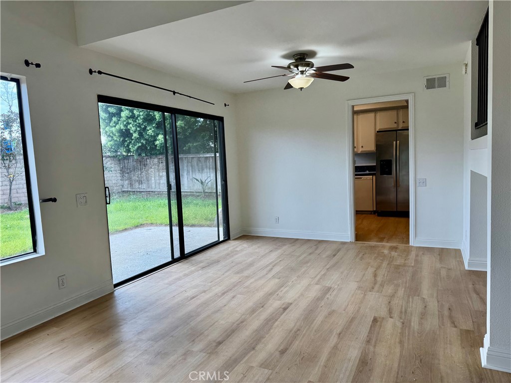 3 Atlanta Irvine, CA 92620 - Photo 13 of 14 a view of an empty room with wooden floor and a window