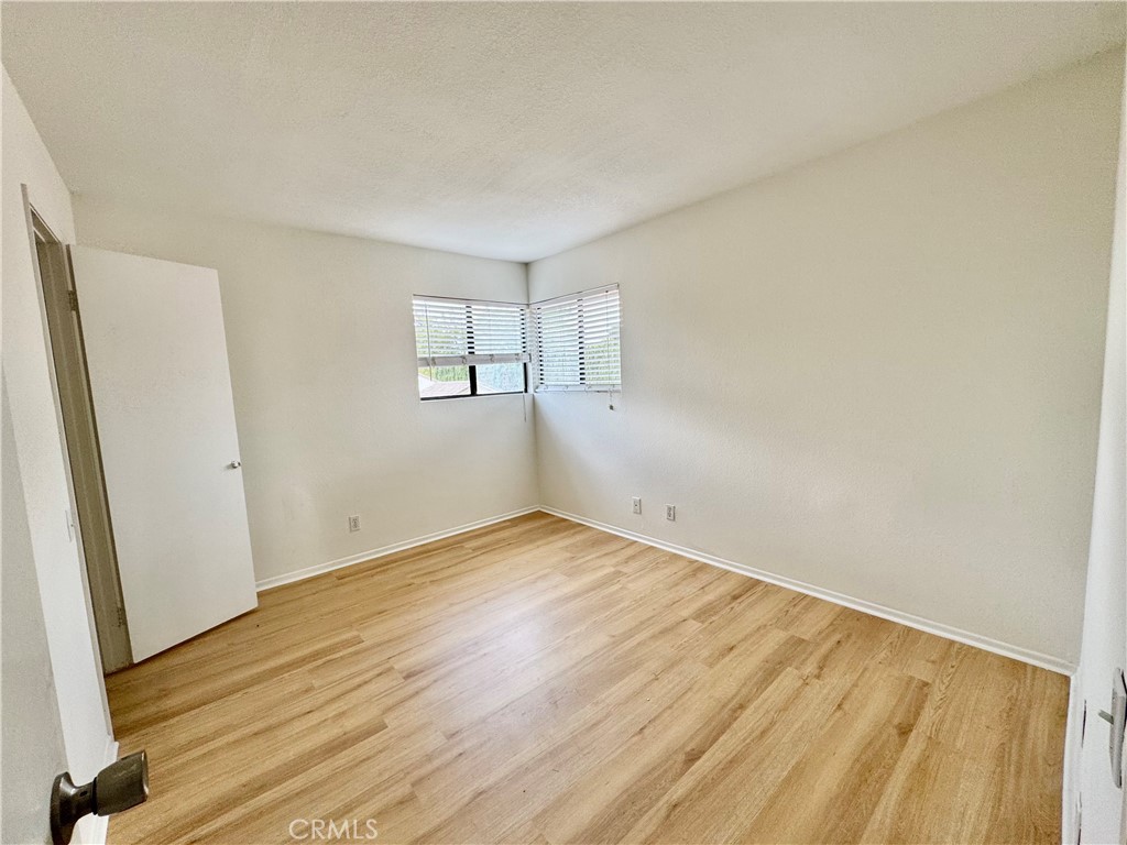 3 Atlanta Irvine, CA 92620 - Photo 7 of 14 an empty room with wooden floor and windows