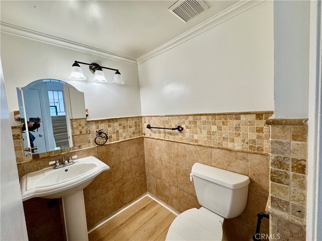 3 Atlanta Irvine, CA 92620 - Photo 8 of 14 a bathroom with a toilet sink and mirror