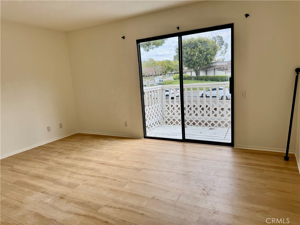 3 Atlanta Irvine, CA 92620 - Photo 10 of 14 a view of an empty room with wooden floor and windows