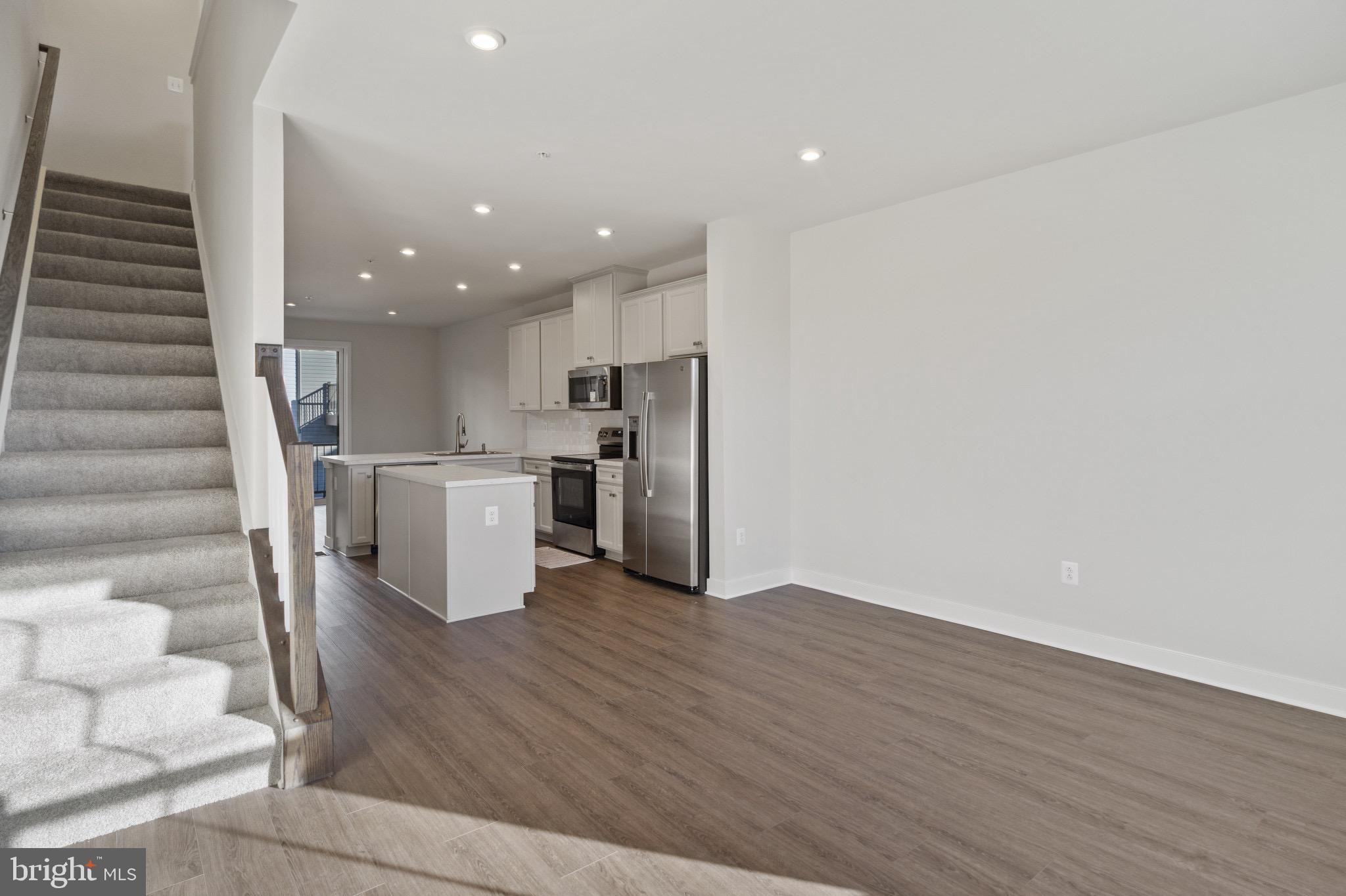 734 Watts Street Baltimore, MD 21217 - Photo 14 of 25 a view of kitchen with cabinets and wooden floor