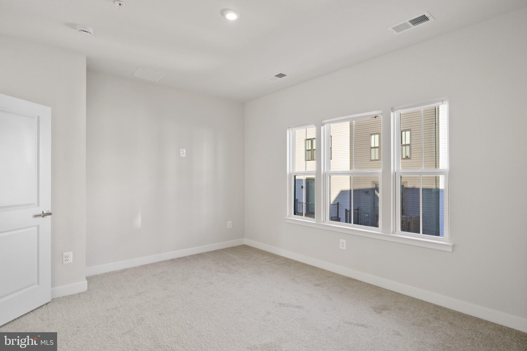 734 Watts Street Baltimore, MD 21217 - Photo 16 of 25 a view of an empty room with a window