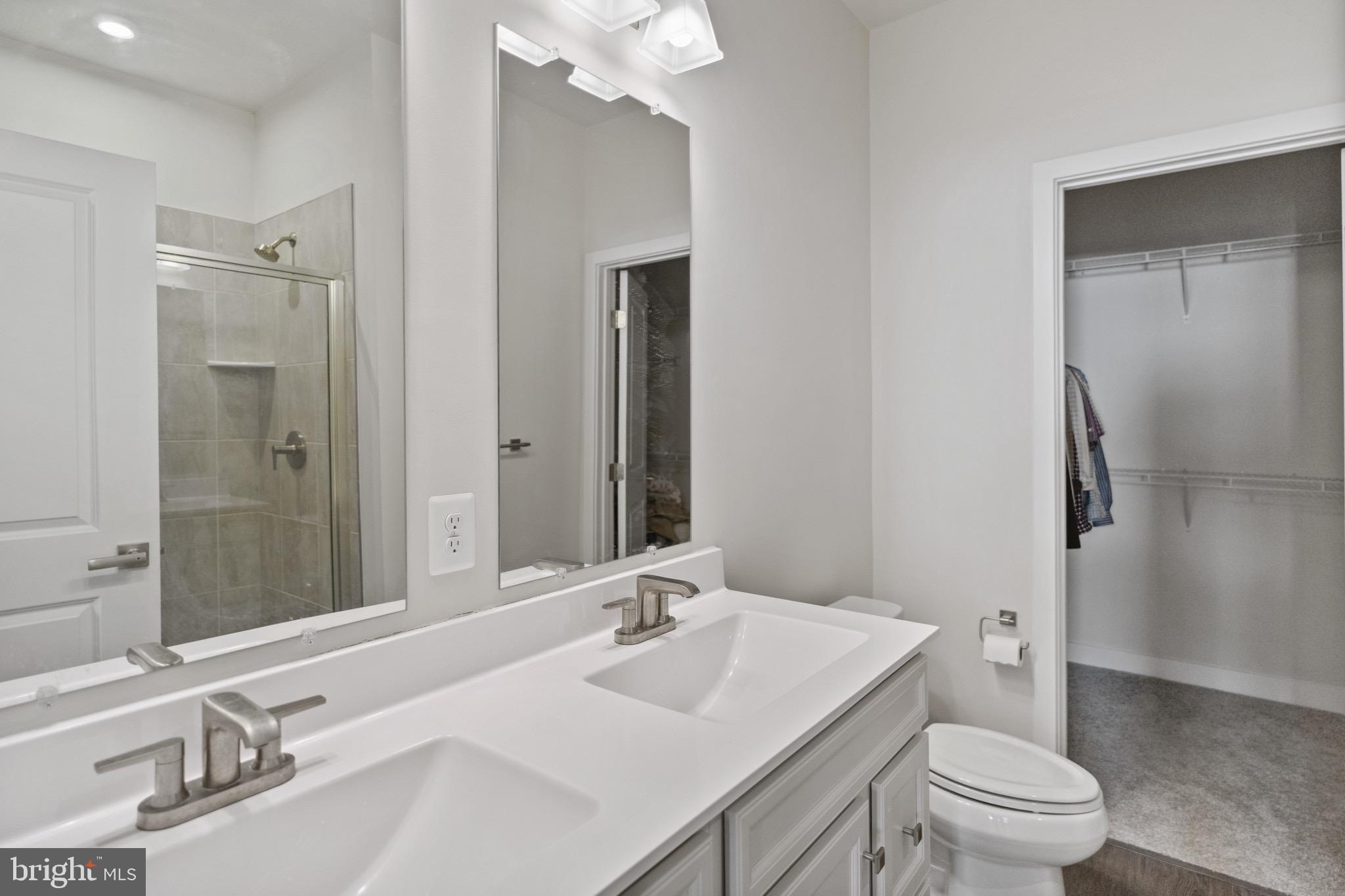 734 Watts Street Baltimore, MD 21217 - Photo 17 of 25 a bathroom with a sink a toilet and shower