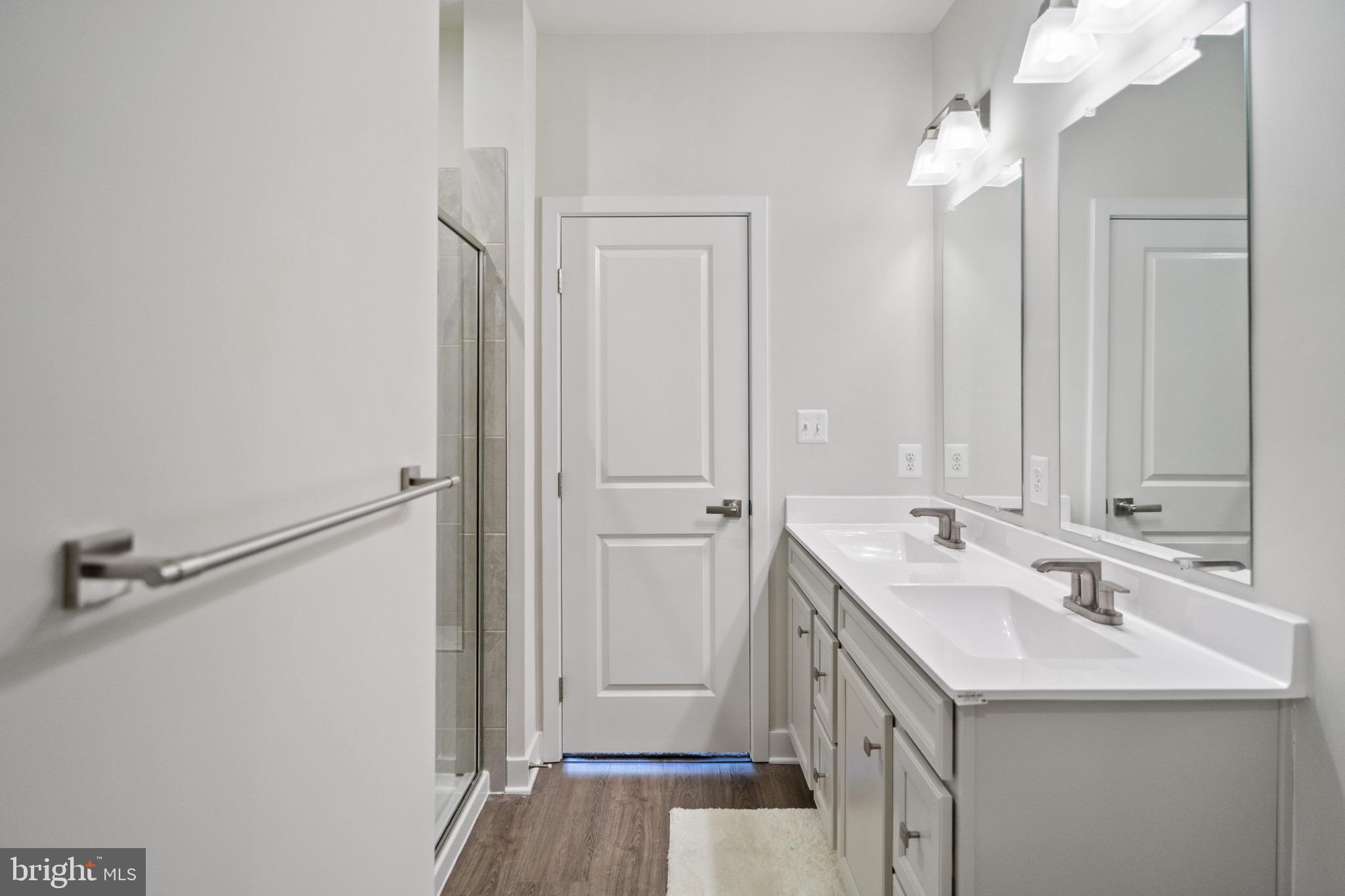 734 Watts Street Baltimore, MD 21217 - Photo 18 of 25 a bathroom with a sink and mirror