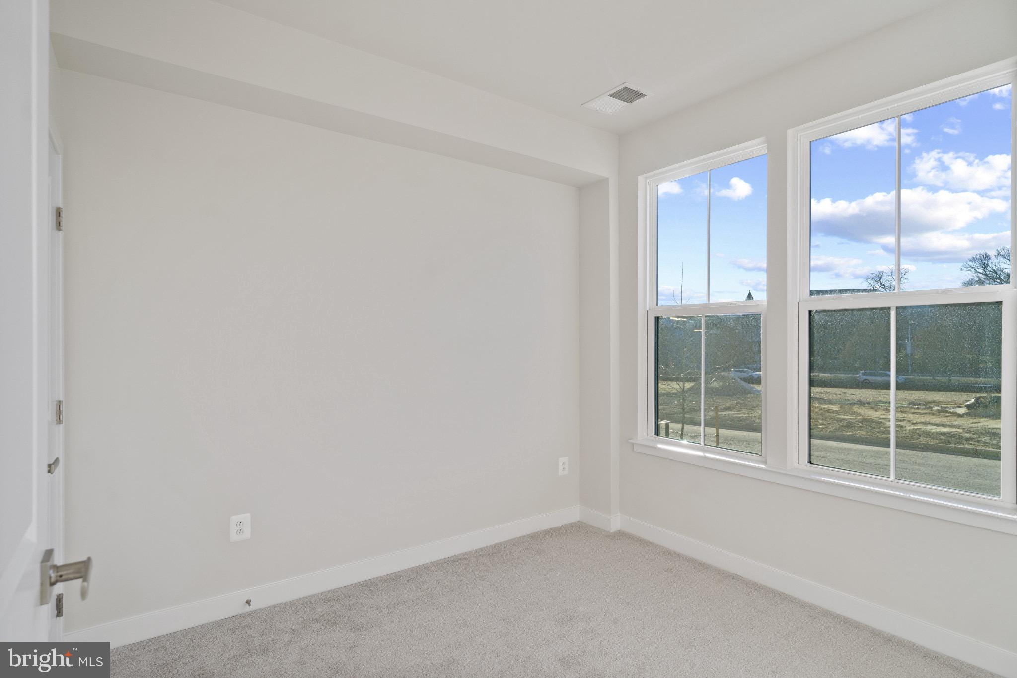 734 Watts Street Baltimore, MD 21217 - Photo 4 of 25 a view of an empty room with a window