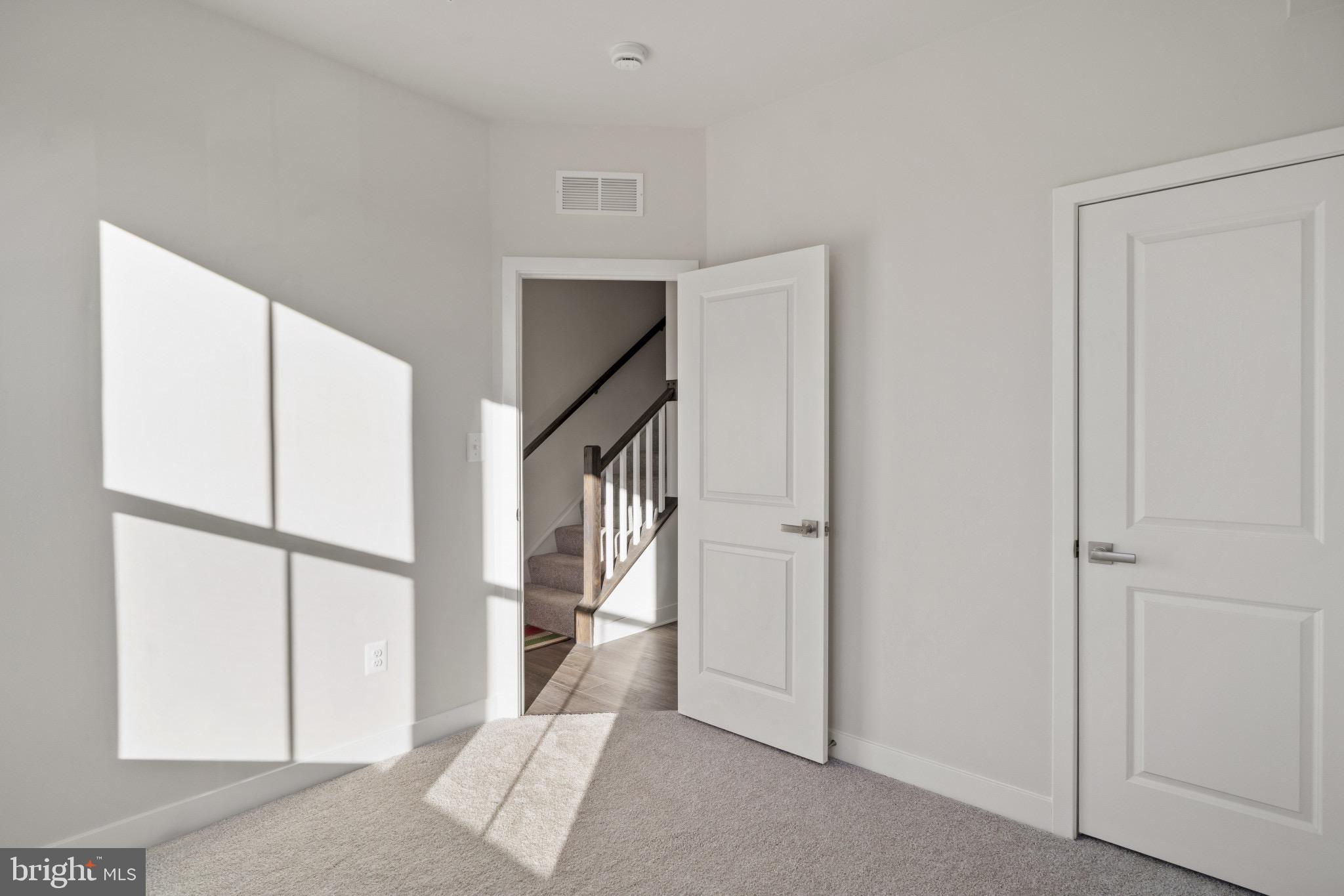 734 Watts Street Baltimore, MD 21217 - Photo 5 of 25 a view of a hallway with windows