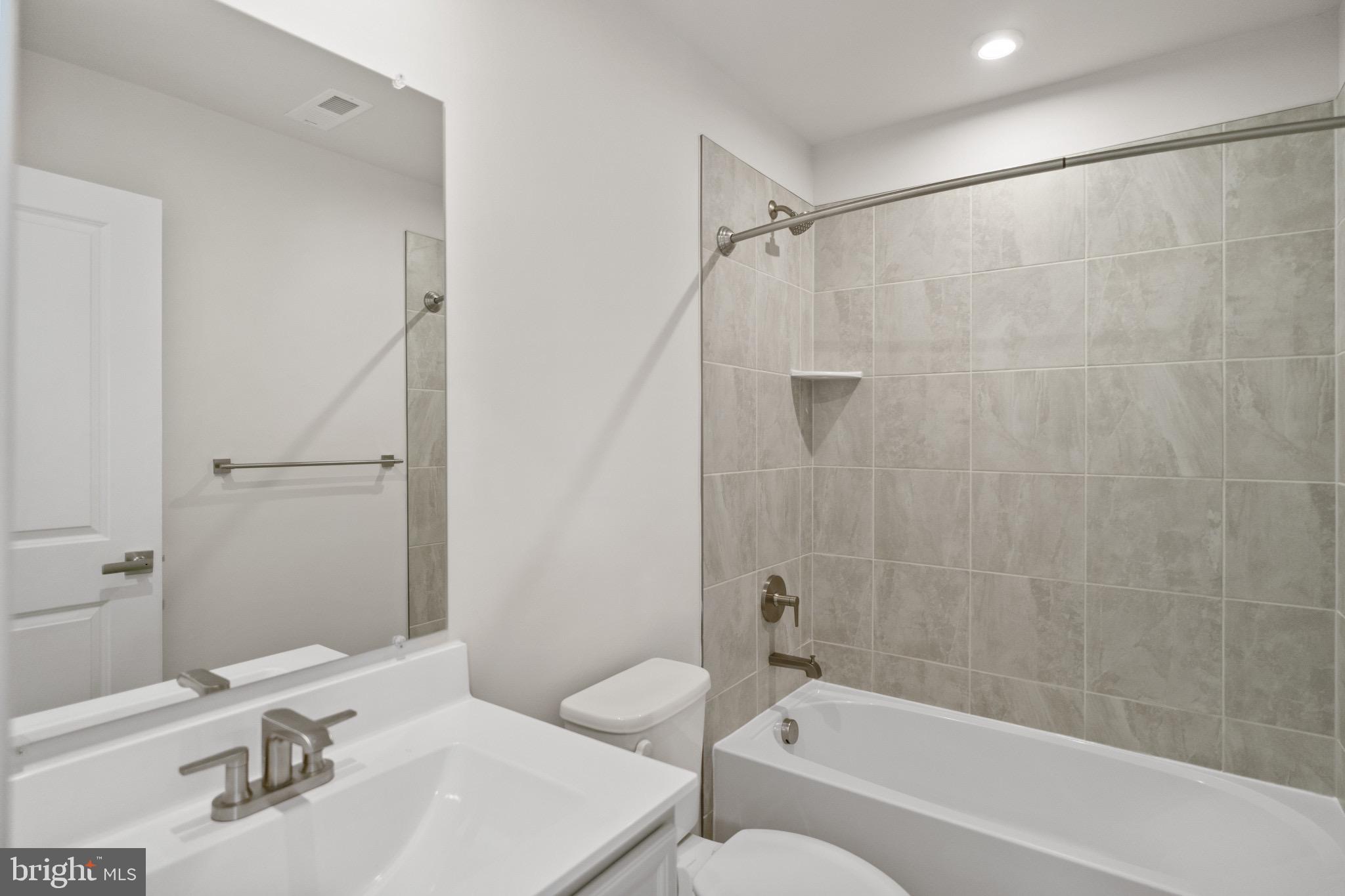 734 Watts Street Baltimore, MD 21217 - Photo 6 of 25 a bathroom with a sink toilet and shower