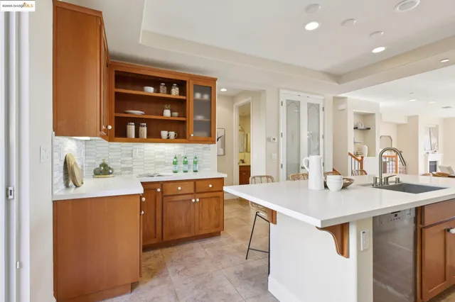 a kitchen with a sink a counter top space and appliances