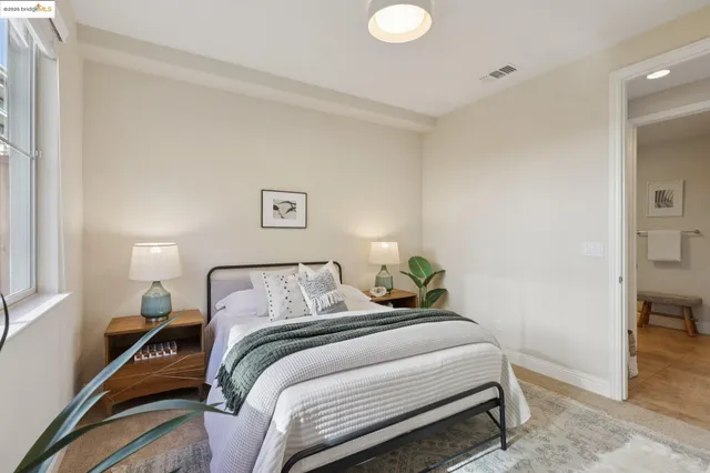 a bedroom with a bed and a table