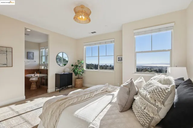 a bedroom with bed and a window