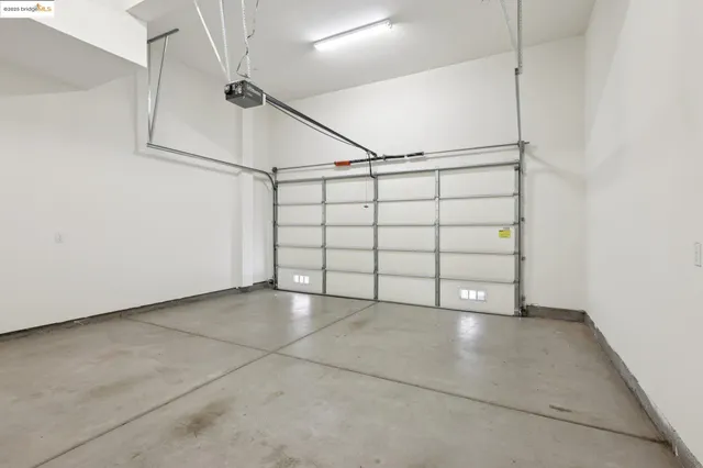 a view of a hallway with chandelier