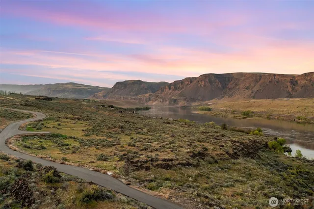 a view of an ocean and a mountain