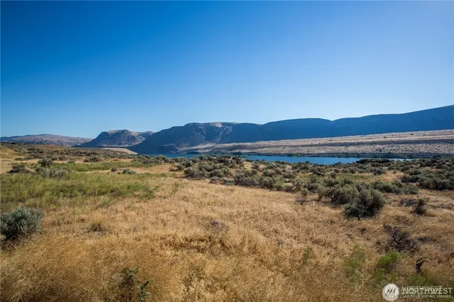 a view of an ocean and a mountain