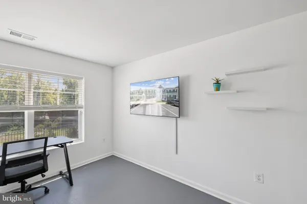 a view of a livingroom with workspace