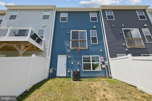 a view of front door of house with an outdoor space