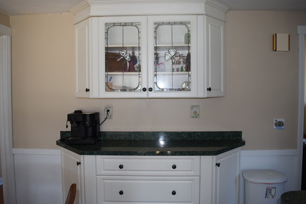 32 Rita Street Springfield, MA 01118 - Photo 11 of 29 a kitchen with granite countertop a sink and cabinets
