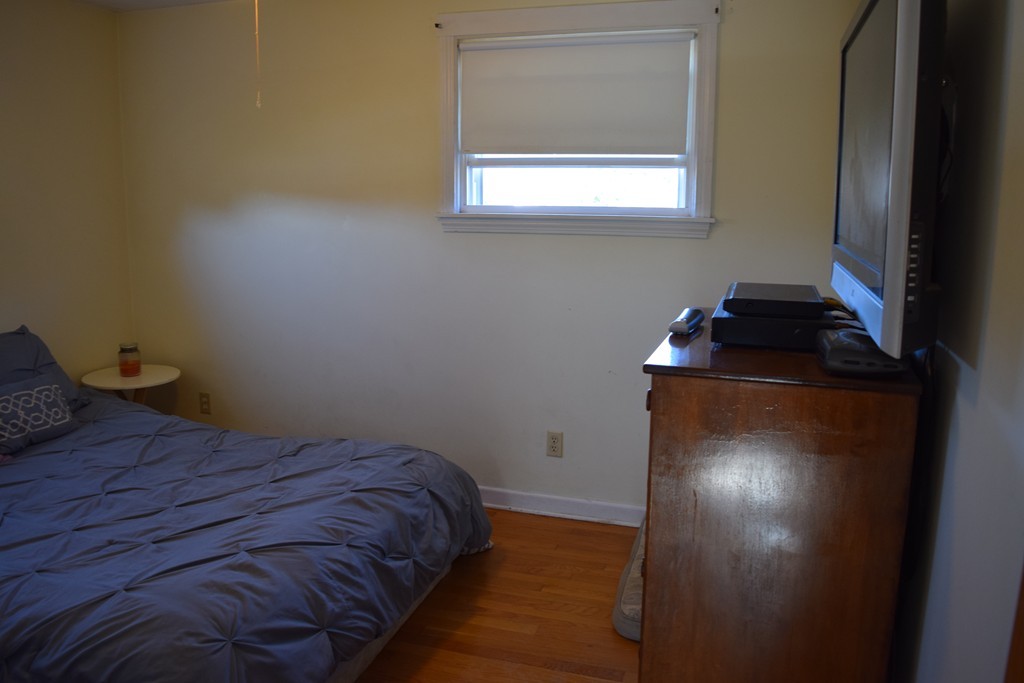 32 Rita Street Springfield, MA 01118 - Photo 13 of 29 a bedroom with a bed and a window