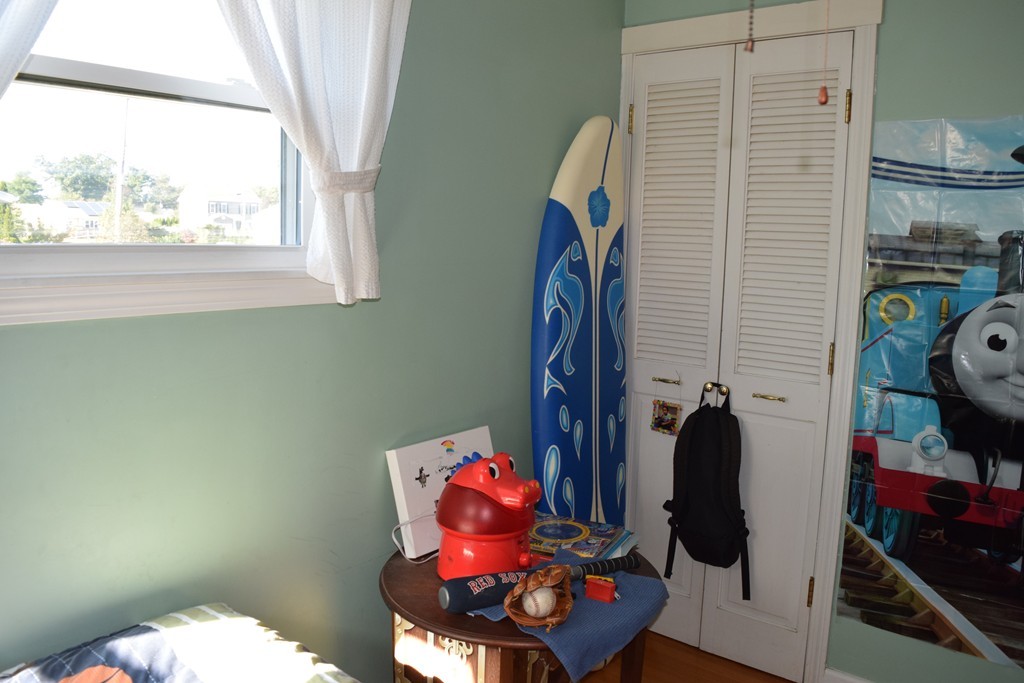 32 Rita Street Springfield, MA 01118 - Photo 15 of 29 a bathroom with a refrigerator and a window