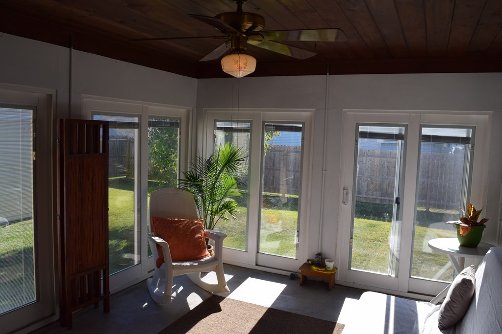 32 Rita Street Springfield, MA 01118 - Photo 18 of 29 a living room filled with furniture and a floor to ceiling window