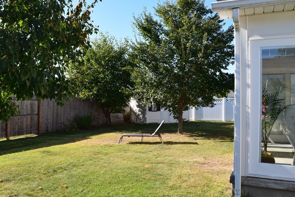 32 Rita Street Springfield, MA 01118 - Photo 25 of 29 a view of a backyard with a small cabin