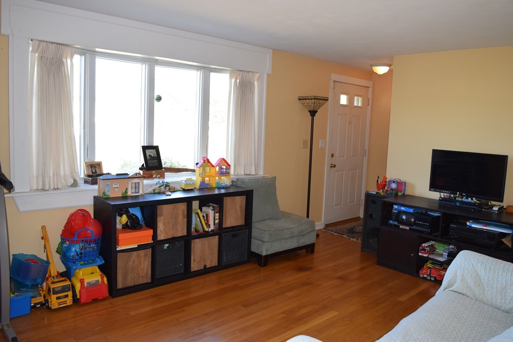32 Rita Street Springfield, MA 01118 - Photo 5 of 29 a living room with furniture and a flat screen tv