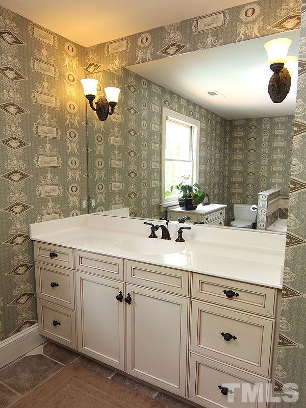 2305 Tyson Street Raleigh, NC 27612 - Photo 15 of 25 a bathroom with a sink vanity and mirror