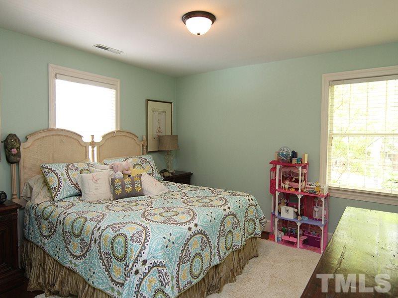2305 Tyson Street Raleigh, NC 27612 - Photo 17 of 25 a bedroom with a bed and a window