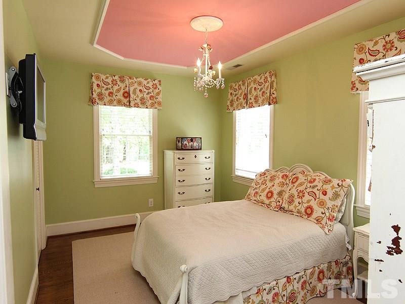 2305 Tyson Street Raleigh, NC 27612 - Photo 18 of 25 a bedroom with a bed dresser and a window