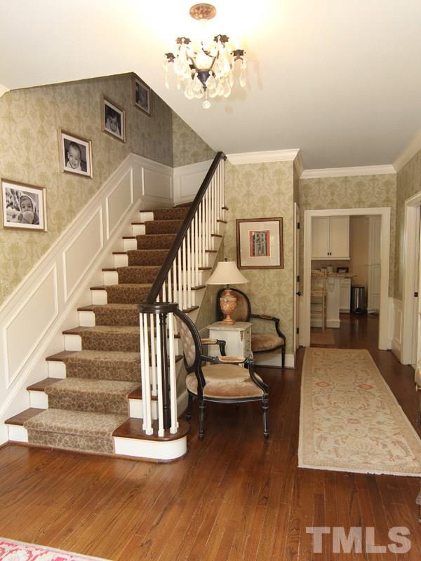 2305 Tyson Street Raleigh, NC 27612 - Photo 3 of 25 a view of entryway and hall with wooden floor